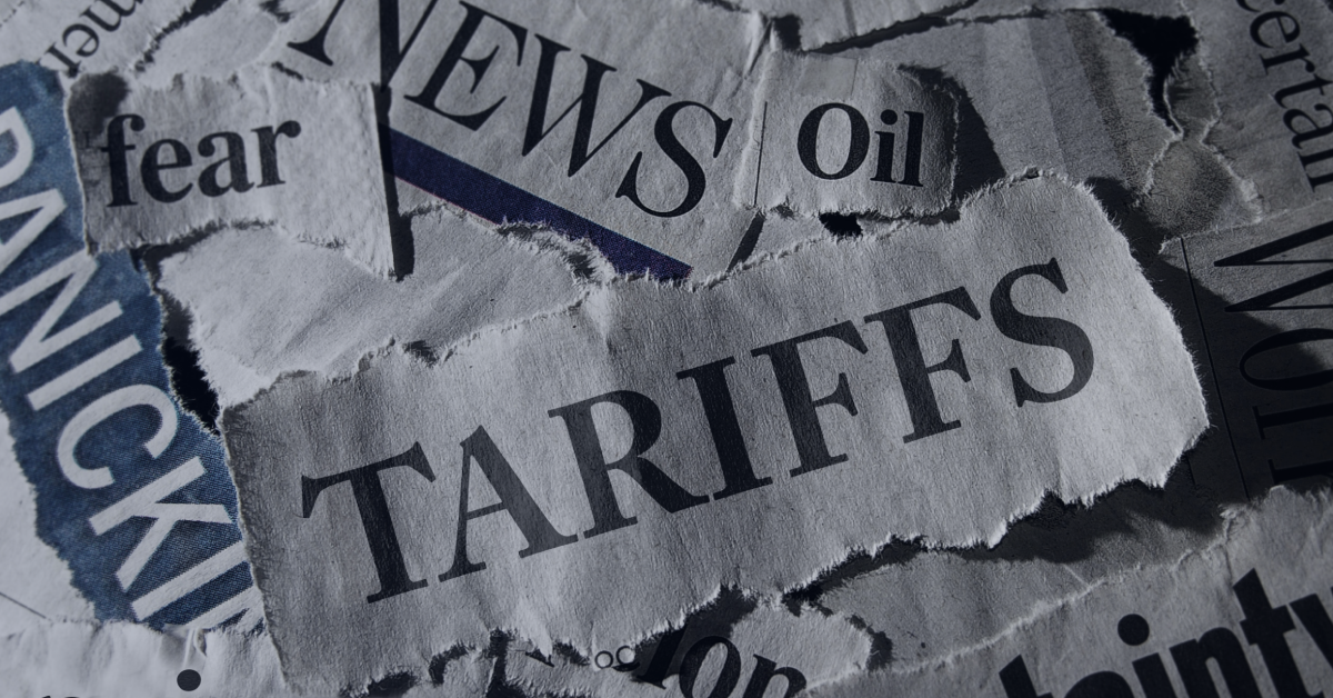 Ripped out newspaper headlines around panic and fear due to tariffs.