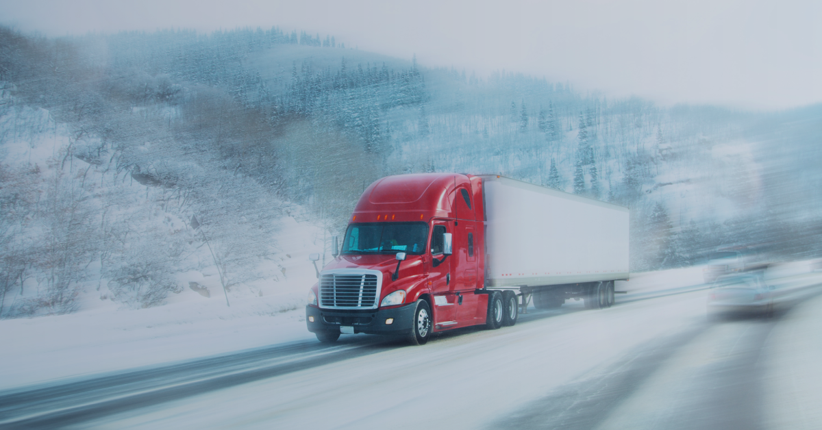 Semi truck driving on a snowy highway, likely using winter blend diesel fuel