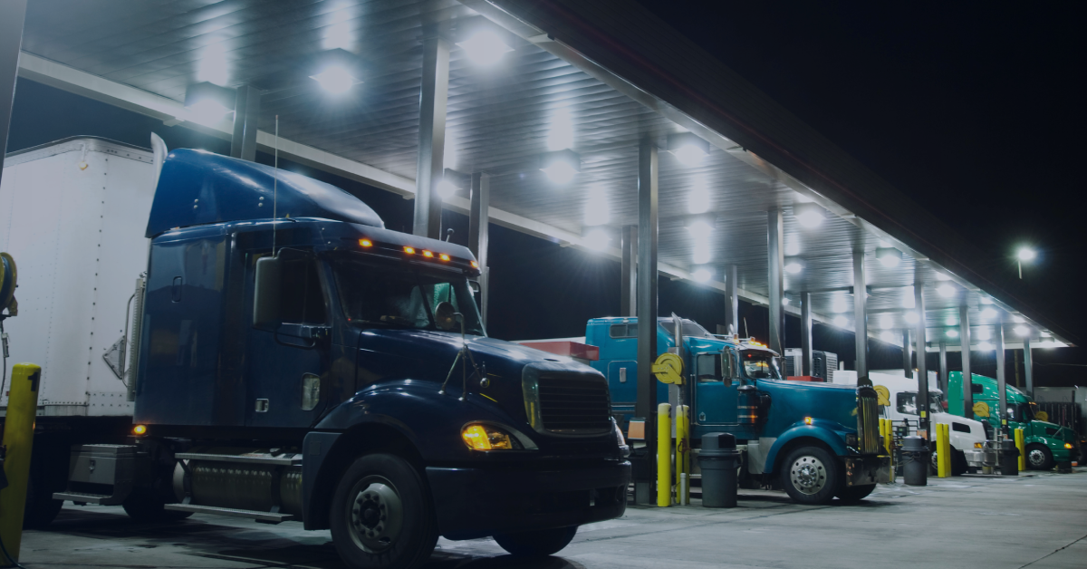 Semi-trucks at a fueling station